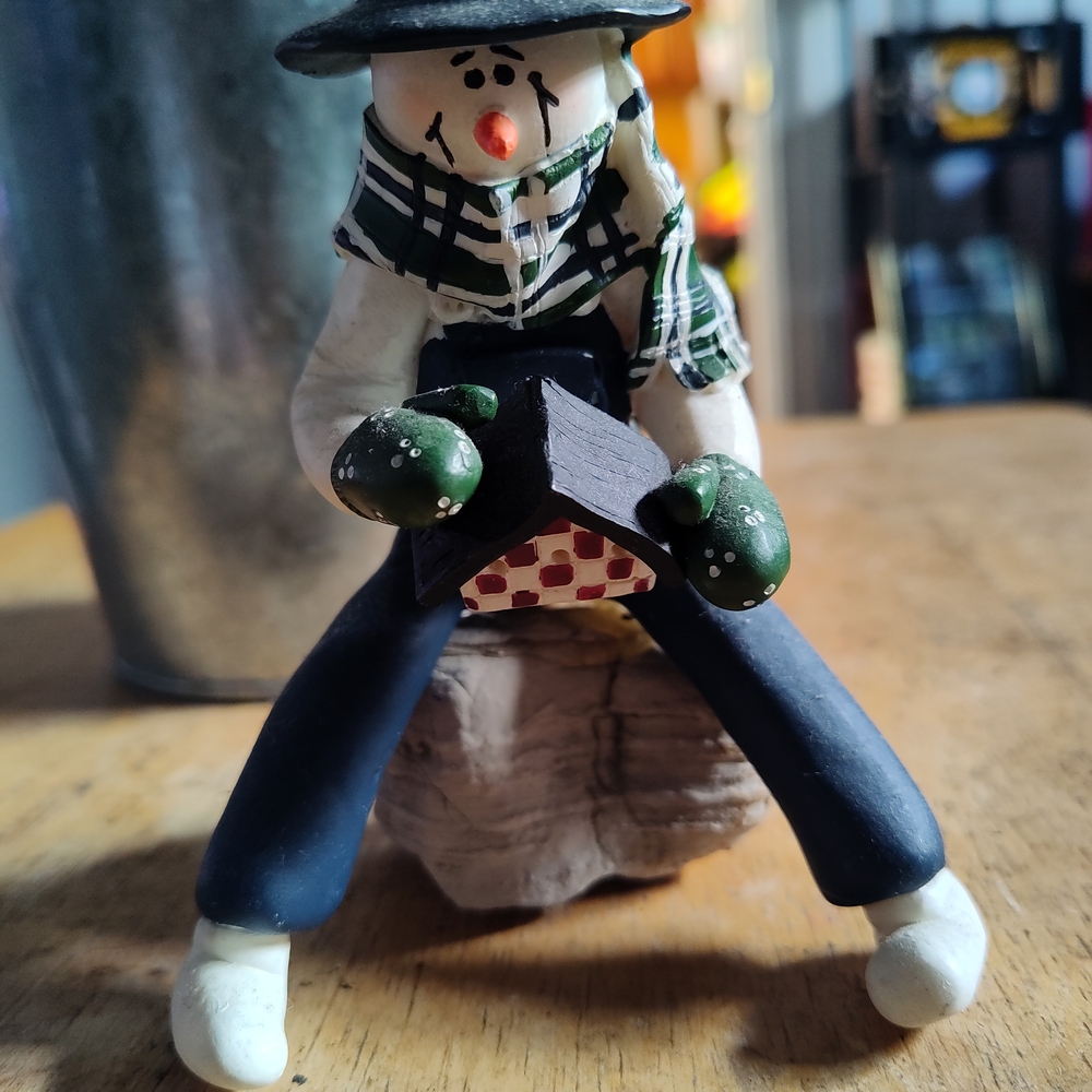 Whimsical Snowman Figurine with Green Mittens